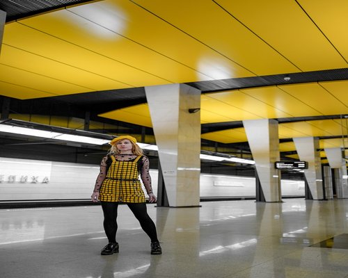 People standing comfortably inside a clean, modern metro train compartment